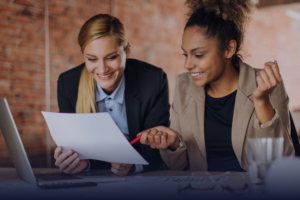 two professionals collaborating over a report