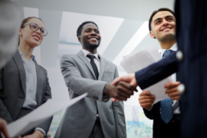 group of professionals shaking hands