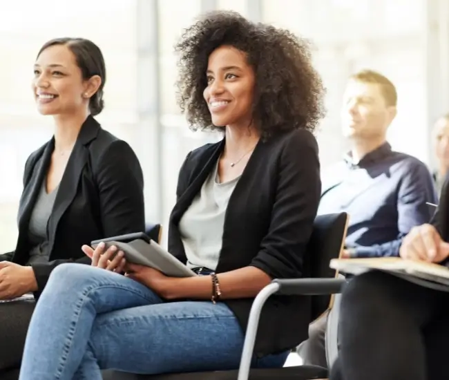 woman sitting in meeting learning