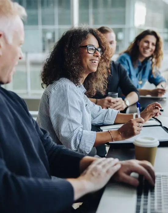 smiling professionals in a meeting