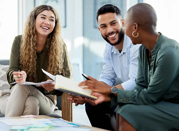 three professionals in meeting